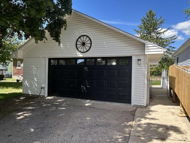 715 Oak St, Shawano, WI 54166 - detached garage featuring a gate