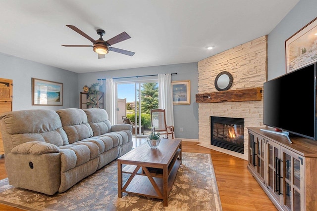 1243 Pond View Cir, De Pere, WI 54115 - living area featuring ceiling fan, a fireplace, and wood finished floors