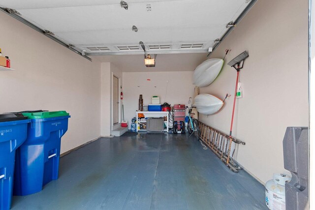 1243 Pond View Cir, De Pere, WI 54115 - garage featuring a garage door opener