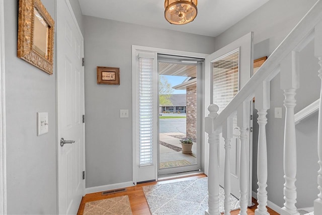 1243 Pond View Cir, De Pere, WI 54115 - entryway with baseboards, wood finished floors, and stairs