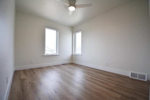 4200 E Lake Vista Blvd, Oak Creek, WI 53154 - empty room featuring wood finished floors, a ceiling fan, and baseboards