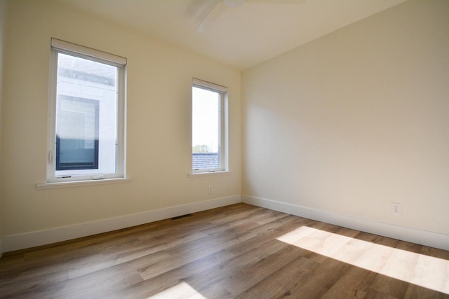 4200 E Lake Vista Blvd, Oak Creek, WI 53154 - spare room with wood finished floors and baseboards