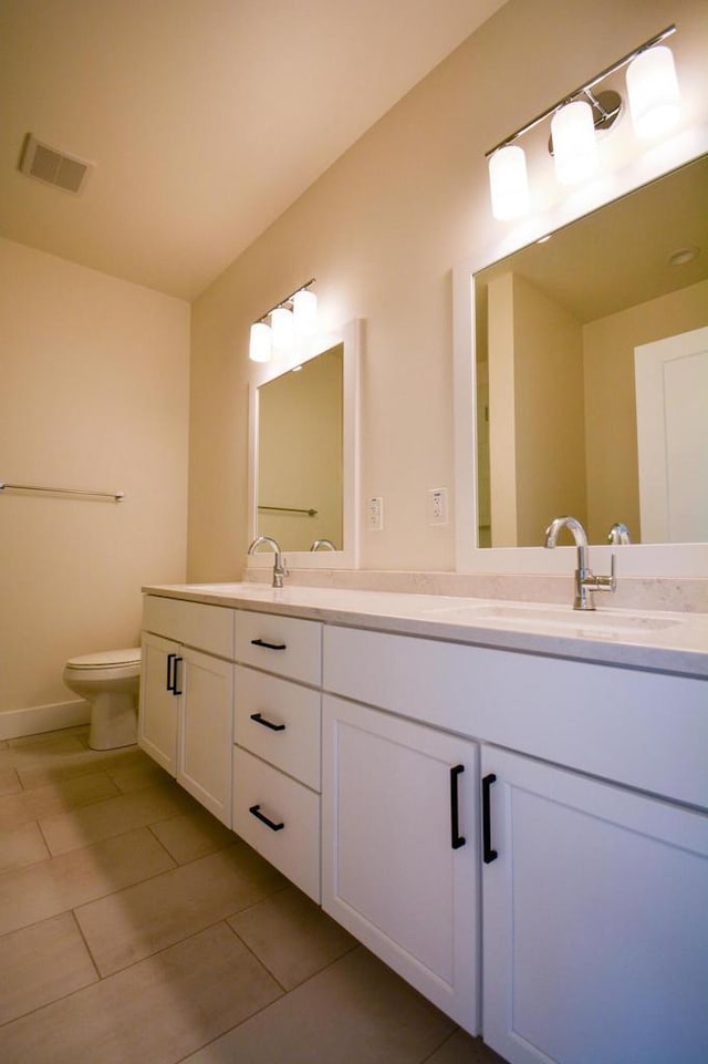 4200 E Lake Vista Blvd, Oak Creek, WI 53154 - full bathroom with double vanity, tile patterned flooring, and toilet