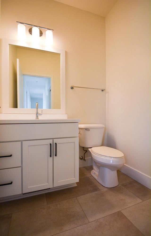 4200 E Lake Vista Blvd, Oak Creek, WI 53154 - bathroom with vanity, toilet, baseboards, and tile patterned floors