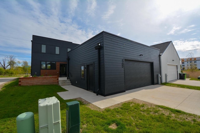 4200 E Lake Vista Blvd, Oak Creek, WI 53154 - contemporary home featuring a front lawn and board and batten siding