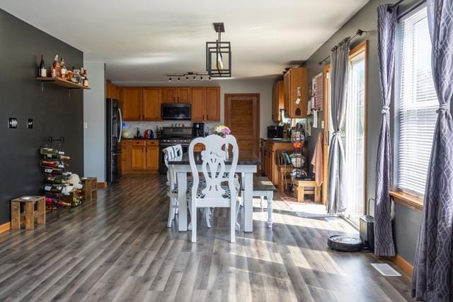 516 Prairie Point Dr, Poplar Grove, IL 61065 - dining area featuring healthy amount of natural light and wood finished floors