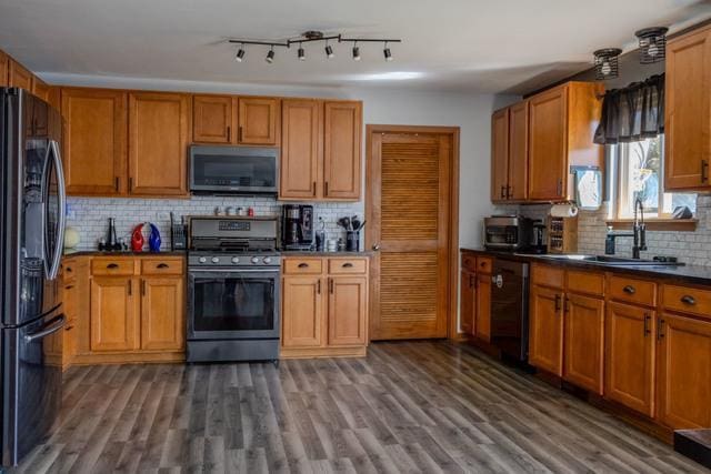 516 Prairie Point Dr, Poplar Grove, IL 61065 - kitchen featuring stainless steel microwave, gas range oven, freestanding refrigerator, dishwasher, and a sink