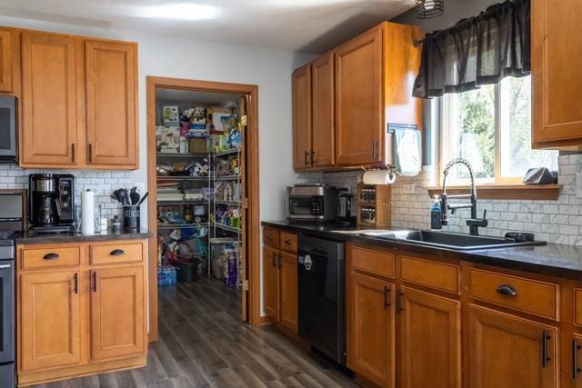 516 Prairie Point Dr, Poplar Grove, IL 61065 - kitchen with dishwasher, tasteful backsplash, dark countertops, and a sink