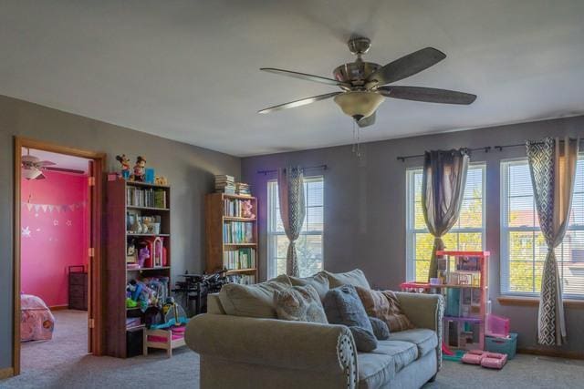 516 Prairie Point Dr, Poplar Grove, IL 61065 - living room featuring a ceiling fan and carpet flooring