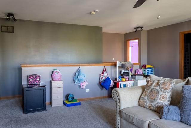 516 Prairie Point Dr, Poplar Grove, IL 61065 - playroom with a ceiling fan, carpet floors, and baseboards