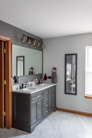 516 Prairie Point Dr, Poplar Grove, IL 61065 - bathroom with double vanity and baseboards