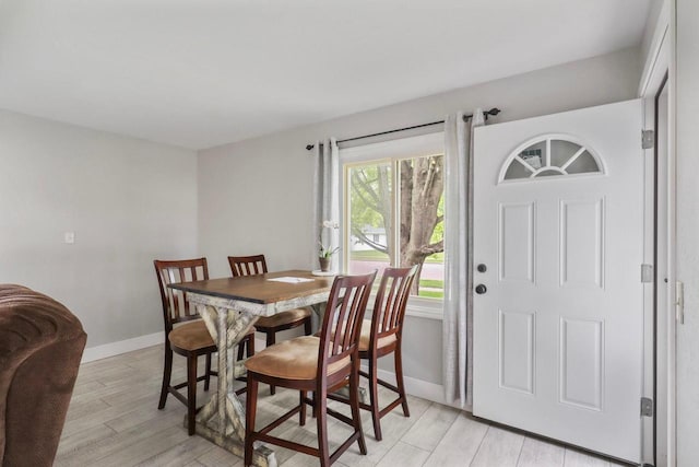 340 12th St S, Wisconsin Rapids, WI 54494 - dining area featuring light wood-style floors and baseboards