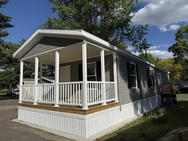 731 Sunset Blvd Unit 29, Wisconsin Dells, WI 53965 - view of home's exterior featuring covered porch and central air condition unit