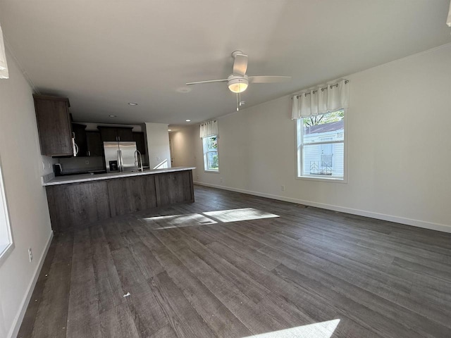 731 Sunset Blvd Unit 29, Wisconsin Dells, WI 53965 - unfurnished living room featuring baseboards, ceiling fan, dark wood-style floors, and recessed lighting