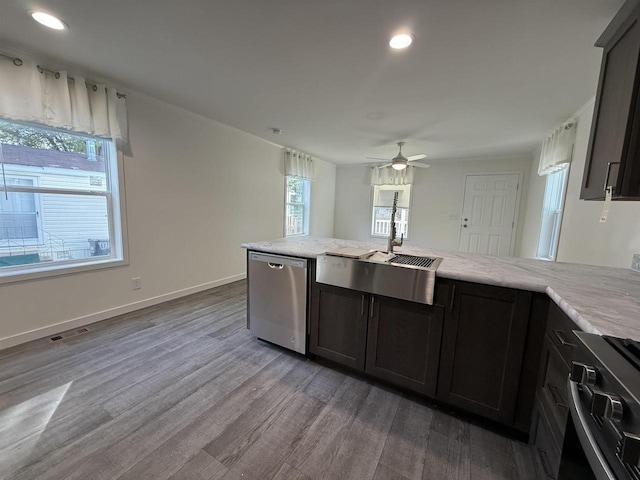731 Sunset Blvd Unit 29, Wisconsin Dells, WI 53965 - kitchen with stainless steel appliances, a sink, wood finished floors, recessed lighting, and ceiling fan