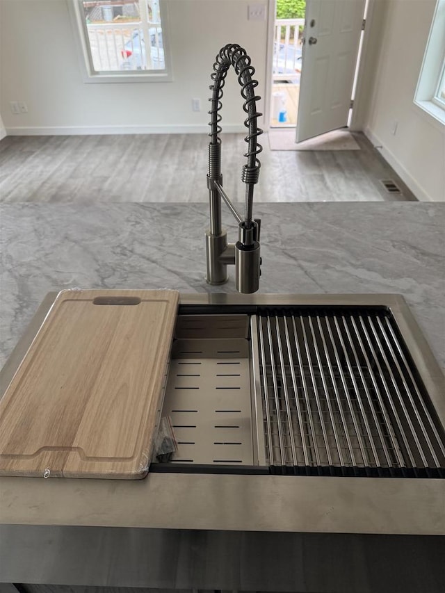 731 Sunset Blvd Unit 29, Wisconsin Dells, WI 53965 - kitchen view of baseboards and a sink
