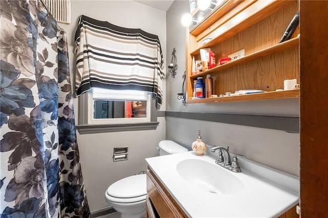 623 Starr Ave, Eau Claire, WI 54703 - bathroom featuring vanity, toilet, and a shower with shower curtain