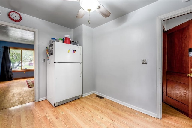623 Starr Ave, Eau Claire, WI 54703 - kitchen featuring freestanding refrigerator, light wood-style floors, ceiling fan, and baseboards
