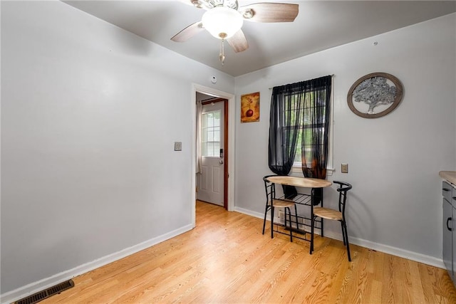 623 Starr Ave, Eau Claire, WI 54703 - dining area featuring light wood-style floors, a ceiling fan, and baseboards