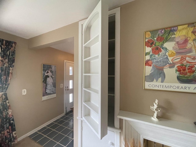 219 Summit St, Portage, WI 53901 - hall featuring dark tile patterned floors and baseboards