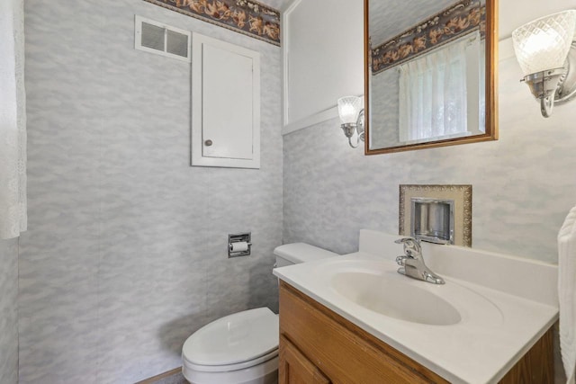 219 Summit St, Portage, WI 53901 - half bath featuring vanity and toilet