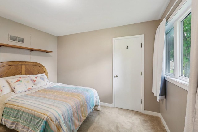219 Summit St, Portage, WI 53901 - bedroom with baseboards and light colored carpet