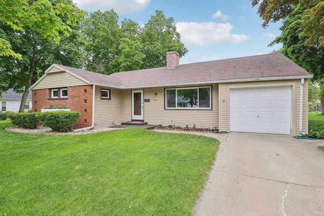 219 Summit St, Portage, WI 53901 - ranch-style home featuring a chimney, concrete driveway, a front yard, an attached garage, and brick siding