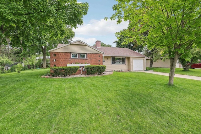 219 Summit St, Portage, WI 53901 - view of front facade with driveway, a chimney, a front yard, and a garage