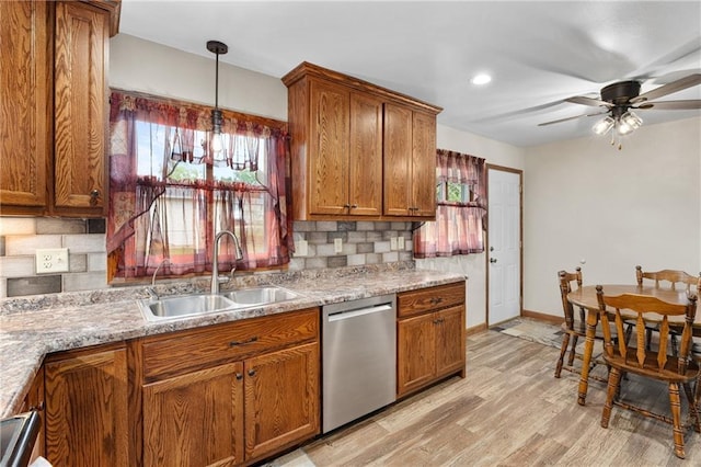 12924 Thomas St, Osseo, WI 54758 - kitchen with dishwasher, a sink, brown cabinetry, decorative backsplash, and recessed lighting