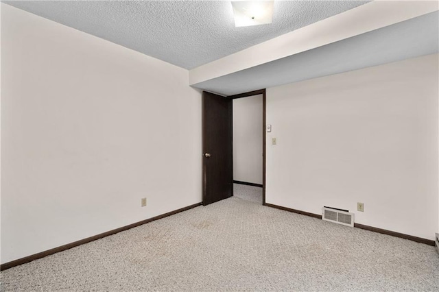 12924 Thomas St, Osseo, WI 54758 - empty room with carpet flooring, baseboards, and a textured ceiling