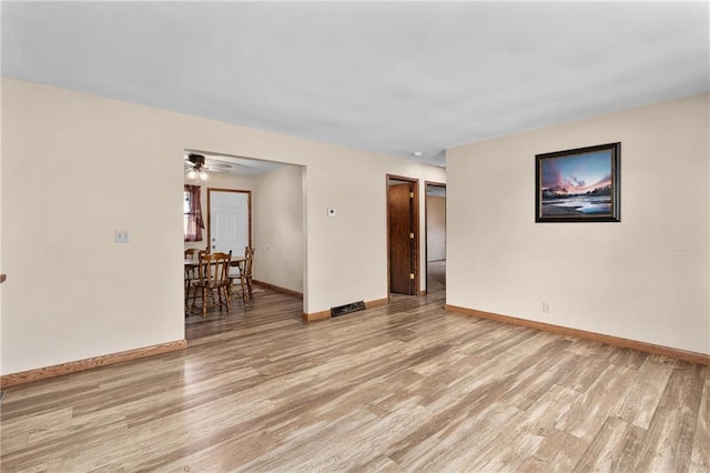 12924 Thomas St, Osseo, WI 54758 - unfurnished room with light wood-style flooring, baseboards, and a ceiling fan