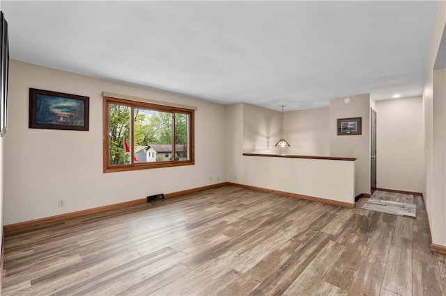 12924 Thomas St, Osseo, WI 54758 - empty room with wood finished floors and baseboards