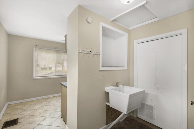 6170 N 36th St, Milwaukee, WI 53209 - bathroom featuring baseboards, tile patterned floors, and vanity