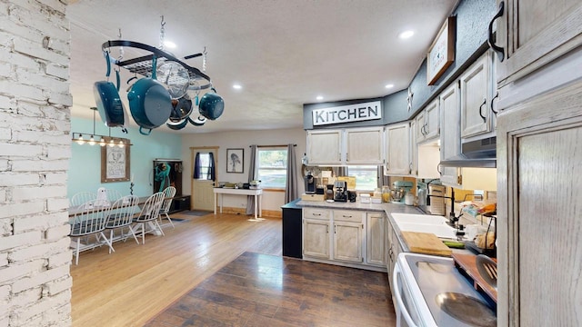 605 Monroe St, Fort Atkinson, WI 53538 - kitchen with range, light countertops, dark wood-style flooring, recessed lighting, and paneled refrigerator