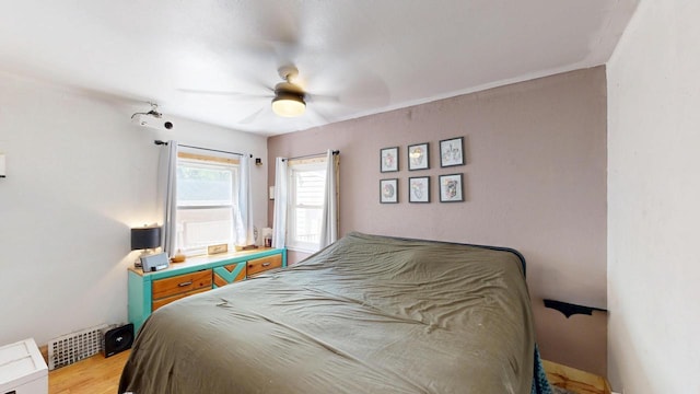 605 Monroe St, Fort Atkinson, WI 53538 - bedroom with wood finished floors and a ceiling fan