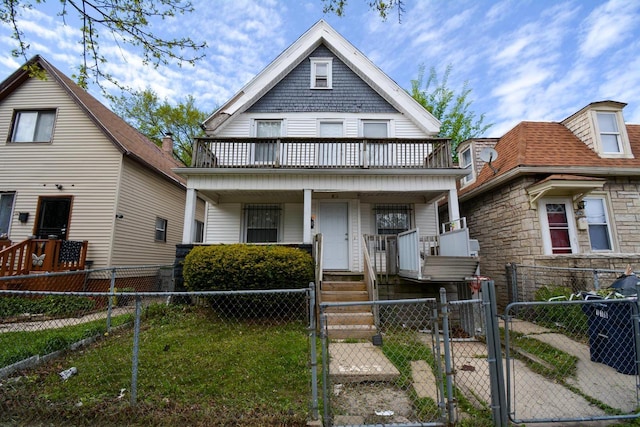 116 E Concordia Ave, Milwaukee, WI 53212 - view of front of house featuring a gate, covered porch, a fenced front yard, and a balcony