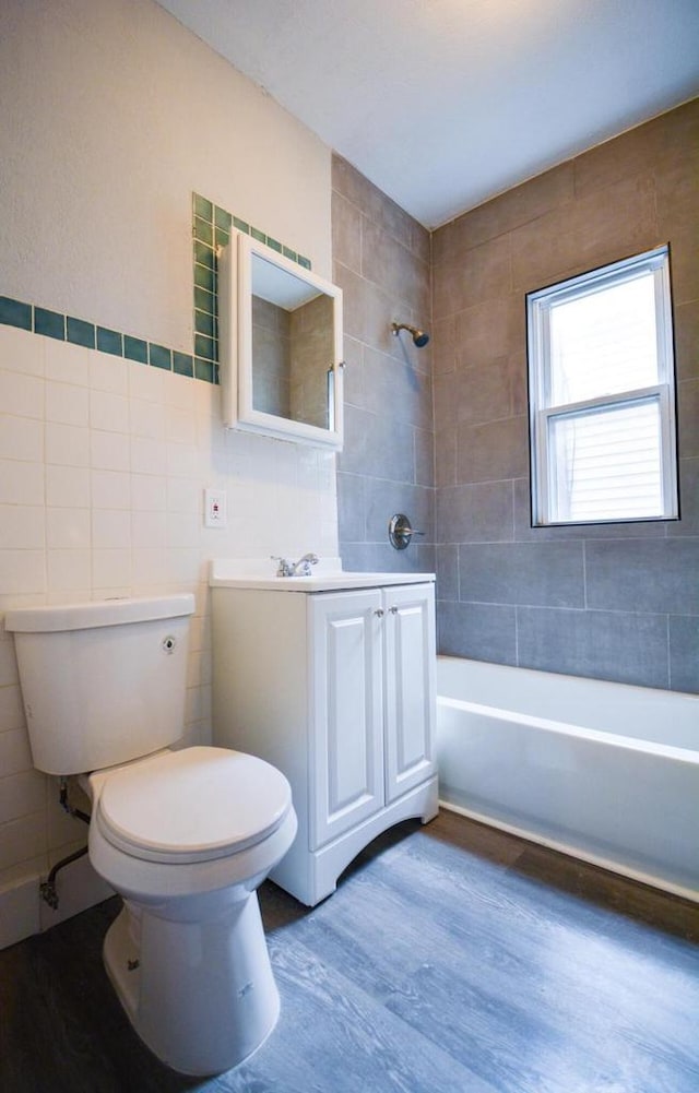 116 E Concordia Ave, Milwaukee, WI 53212 - full bathroom with tile walls, wood finished floors, toilet, vanity, and bathtub / shower combination