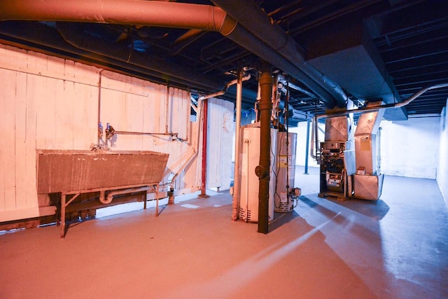 116 E Concordia Ave, Milwaukee, WI 53212 - unfinished below grade area with a sink, heating unit, and water heater