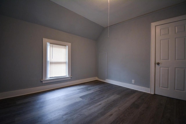 116 E Concordia Ave, Milwaukee, WI 53212 - empty room featuring dark wood-type flooring, baseboards, and lofted ceiling