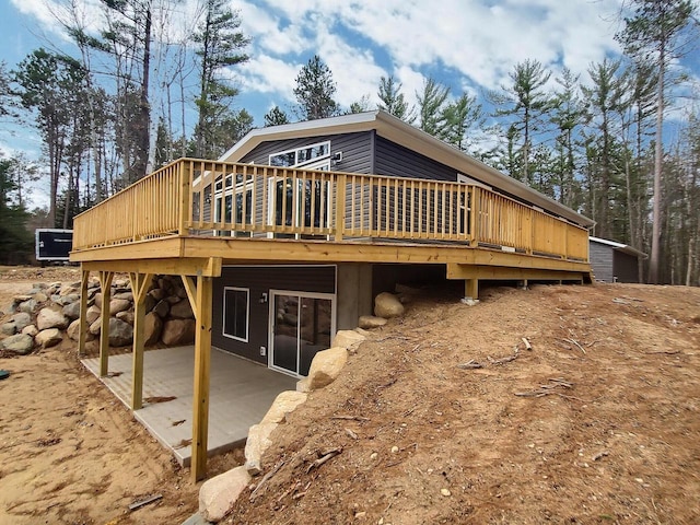 4533 Warner Dr, Rhinelander, WI 54501 - rear view of property with a patio and a wooden deck