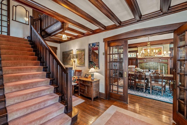 2615 N Summit Ave, Milwaukee, WI 53211 - stairs with a chandelier, hardwood / wood-style floors, crown molding, and baseboards