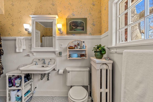 2615 N Summit Ave, Milwaukee, WI 53211 - full bath with wallpapered walls, wainscoting, toilet, tile patterned floors, and a sink