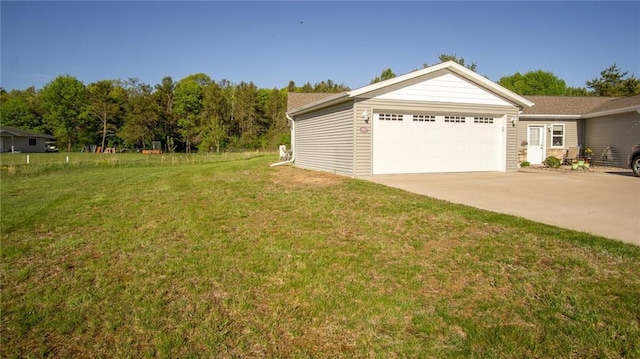 18925 63rd Ave Unit A1, Chippewa Falls, WI 54729 - view of grassy yard with an attached garage