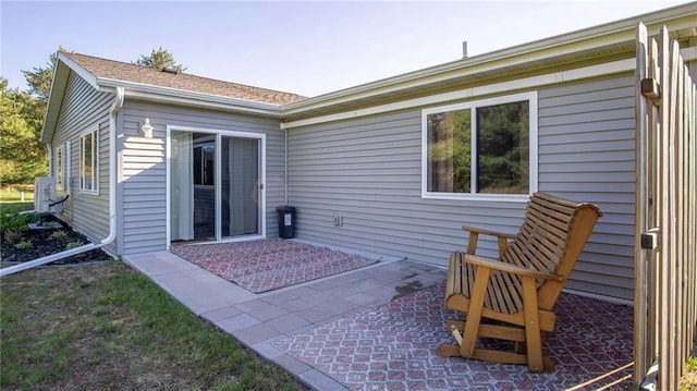 18925 63rd Ave Unit A1, Chippewa Falls, WI 54729 - rear view of house with a patio