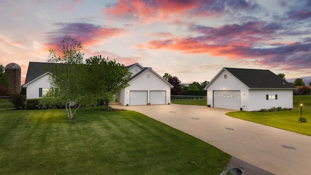 W9555 Zimmerman Dr, Beaver Dam, WI 53916 - view of front of property featuring a garage, an outdoor structure, and a lawn