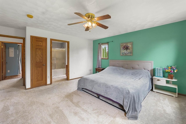W9555 Zimmerman Dr, Beaver Dam, WI 53916 - bedroom with carpet, baseboards, ceiling fan, and ensuite bathroom