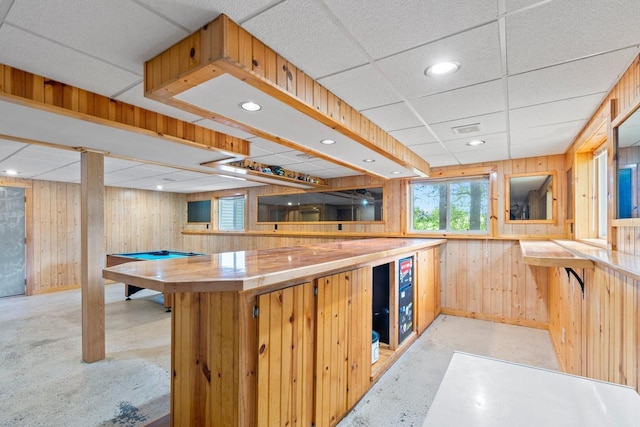 554 N Harvard Ave, Endeavor, WI 53930 - kitchen with wood walls, healthy amount of natural light, a paneled ceiling, baseboards, and recessed lighting