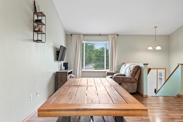 554 N Harvard Ave, Endeavor, WI 53930 - living room with wood finished floors, a chandelier, and baseboards