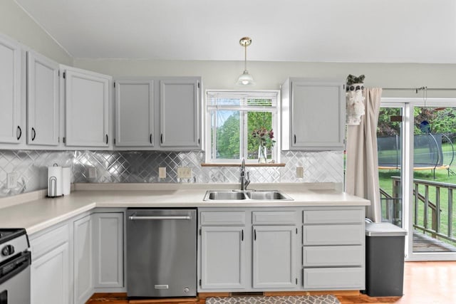 554 N Harvard Ave, Endeavor, WI 53930 - kitchen featuring dishwasher, a sink, tasteful backsplash, and light countertops