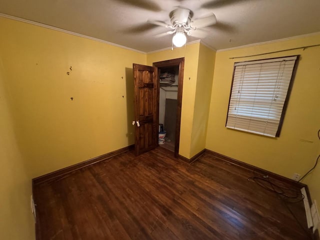 8444 Fish Hatchery Rd, Burlington, WI 53105 - unfurnished bedroom featuring dark wood finished floors, ornamental molding, baseboards, a closet, and ceiling fan